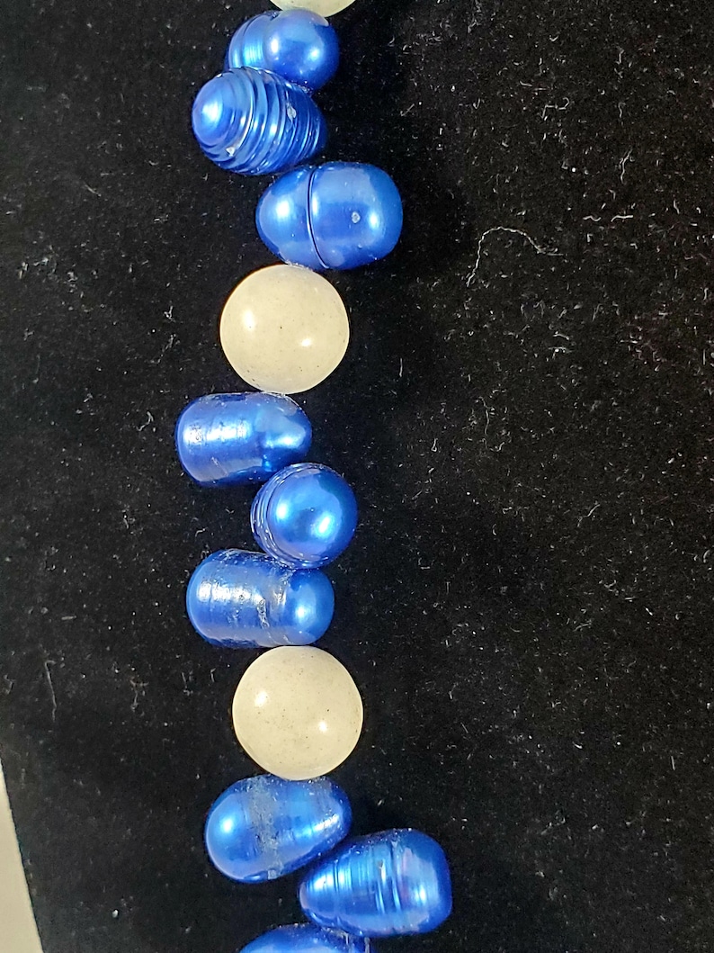 Necklace and earrings made with fresh water pearls dyed blue
