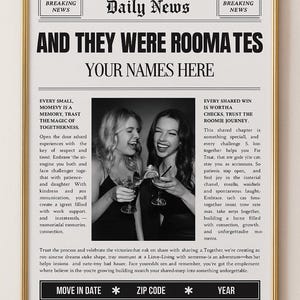 May include: A framed print designed to resemble a newspaper front page. The headline reads "AND THEY WERE ROOMMATES" with space for names. Two women are pictured, toasting with drinks. The print has a gold frame.