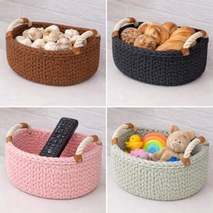 May include: Four oval-shaped, crocheted baskets in brown, dark gray, pink, and light green. Each basket has rope handles with leather accents. The baskets are filled with garlic, bread, a remote control, and toys.