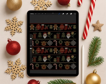 May include: A digital tablet shows a Christmas jumper design in red, green, and white. The tablet is surrounded by festive decorations, including red and gold baubles, wooden snowflakes, a candy cane, and a sprig of pine.