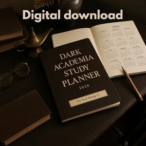 May include: A dark brown "Dark Academia Study Planner 2026" book with the text "This Book Belongs To" on the cover. An open planner with a 2026 calendar, a pencil, and a small brass lamp are also visible.