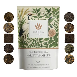 May include: A variety sampler of compressed tea in a white and beige package. The package features a crane illustration and the text "Cushla Tea Co." and "Variety Sampler." Ten compressed tea samples are displayed around the package. Net weight is 60g.