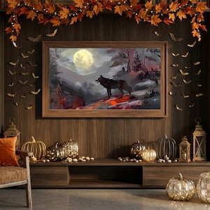 May include: A rectangular framed wall art print depicting a dark wolf standing on a rocky ledge under a large full moon in a misty forest landscape. The artwork features a palette of deep grays, muted browns, and vibrant orange highlights.