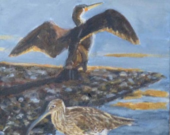 May include: A painting of a brown and black bird with its wings spread wide, standing on a rocky shore. A smaller brown and white bird with a long beak is in the foreground, standing on the shore.
