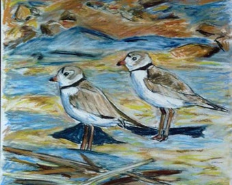 May include: A pastel painting of two shorebirds on a sandy beach. The birds are white with brown markings and have long, thin legs. The background is a blue and brown wash of color.