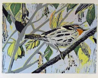 May include: A colorful linocut print of a bird perched on a branch. The bird is a light brown and gray with a yellow breast and a black eye. The background is a light blue with green and yellow leaves.