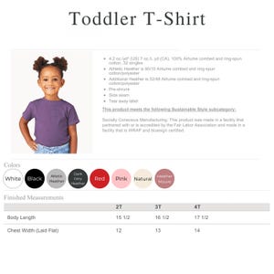 a young girl wearing a purple toddler T-shirt.