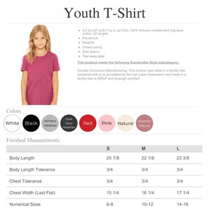 A young girl wearing a pink t-shirt, posing for a photograph.