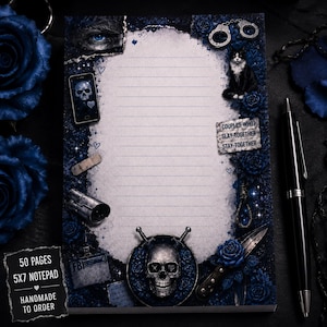 May include: A 5x7 notepad with 50 pages featuring a dark blue floral border, a central lined writing area, a skull, a cat, handcuffs, a smartphone with a skull screen, a bandage, a security camera, an FBI badge, and a knife with the text COUPLES WHO SLAY TOGETHER STAY TOGETHER.