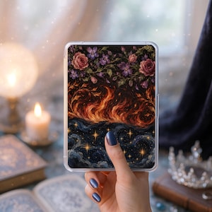 May include: A rectangular clear phone case featuring a printed design with three distinct horizontal sections: a top layer of pink and purple flowers, a middle layer of swirling orange and red flames, and a bottom layer of a dark starry night sky.