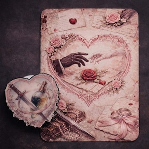May include: A romantic illustration with a heart-shaped design showing two hands reaching out. The image includes roses, a dagger, a vial, and wedding rings, in soft pink and cream tones. Decorative elements include vintage letters and a heart-shaped accent.