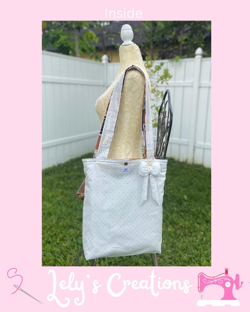 May include: White tote bag with small black polka dots, a bow, and patterned straps. The bag is displayed on a mannequin in front of a white fence and greenery. The text "Inside" is at the top.