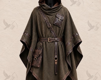 May include: A dark olive green hooded poncho featuring a brown leather belt at the waist, a matching leather shoulder strap with metal studs, and two attached leather pouches. The garment has a pointed hemline and dark brown leather trim along the edges.