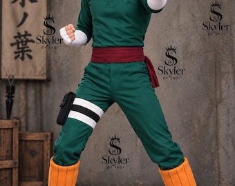 May include: A green long-sleeved jumpsuit with a quarter-zip collar, a dark red sash at the waist, white hand wraps, a black leg pouch, white leg bands, and orange leg warmers worn with black open-toed sandals, styled after a fictional character.