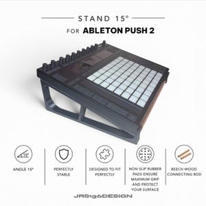 May include: A black stand designed for the Ableton Push 2, angled at 15 degrees. The stand features non-slip rubber pads and beech wood connecting rods. Text on the image reads "STAND 15° FOR ABLETON PUSH 2" and "JRS136DESIGN".