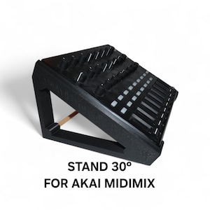 Pode incluir: Suporte preto para um Akai Midimix, inclinado a 30 graus. O suporte apresenta uma série de botões e controles deslizantes, com o texto "STAND 30° FOR AKAI MIDIMIX" impresso na frente.