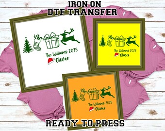 May include: Three framed Christmas-themed DTF transfer designs. Each design features a Christmas tree, stocking, gift, and reindeer silhouette. The text reads "The Williams 2025 Oliver". The transfers are ready to press.