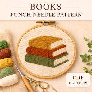 May include: A punch needle pattern featuring a stack of three books in shades of gold, rust, and green, set within a wooden embroidery hoop. The text "BOOKS PUNCH NEEDLE PATTERN" is at the top, and "PDF PATTERN" is at the bottom.