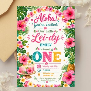 May include: A tropical-themed birthday invitation card featuring a floral border of pink and yellow hibiscus flowers and green palm leaves. The text reads Aloha! You're Invited! Our Little Lei-dy EMILY is turning ONE, with event details below.