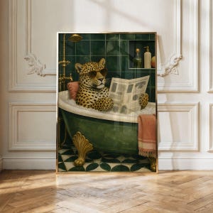 May include: A framed wall art print depicting a leopard wearing sunglasses while sitting in a dark green clawfoot bathtub filled with bubbles. The leopard holds an open newspaper. A pink towel hangs over the side, and a gold shower fixture is visible.