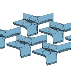 May include: A collection of light blue, geometric components. Each piece has a curved shape with a circular indentation and rectangular extensions. The components are arranged in a seemingly random pattern against a white background.