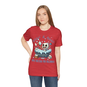 Little skeleton scrubbing in a tube, Halloween Shirt, Spooky T-Shirt, little skeleton waiting for Halloween, Unisex Jersey Short Sleeve Tee