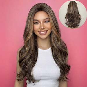 May include: A long, wavy wig with brown and blonde highlights. The wig features a natural-looking hairline and is styled with loose curls. A smaller image of the wig's back is in the upper right corner. The person in the image is wearing a white tank top.