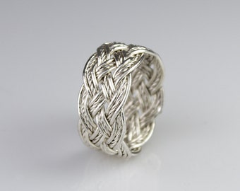 Hand-tied silver wire Turks Head Knot ring with a twist