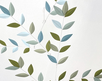 Hanging art mobile with color transition, green to soft blue for elevated decor