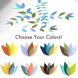 May include: A decorative mobile with leaf-shaped elements in shades of blue and green, and a selection of colorful flower-like shapes. The text "Choose Your Colors!" is displayed below the mobile and flower shapes.