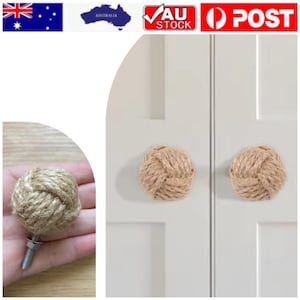 May include: Two beige rope knot cabinet knobs fixed to a white door. The knobs are spherical and have a textured finish. A single knob is shown with a bolt and nut attached.