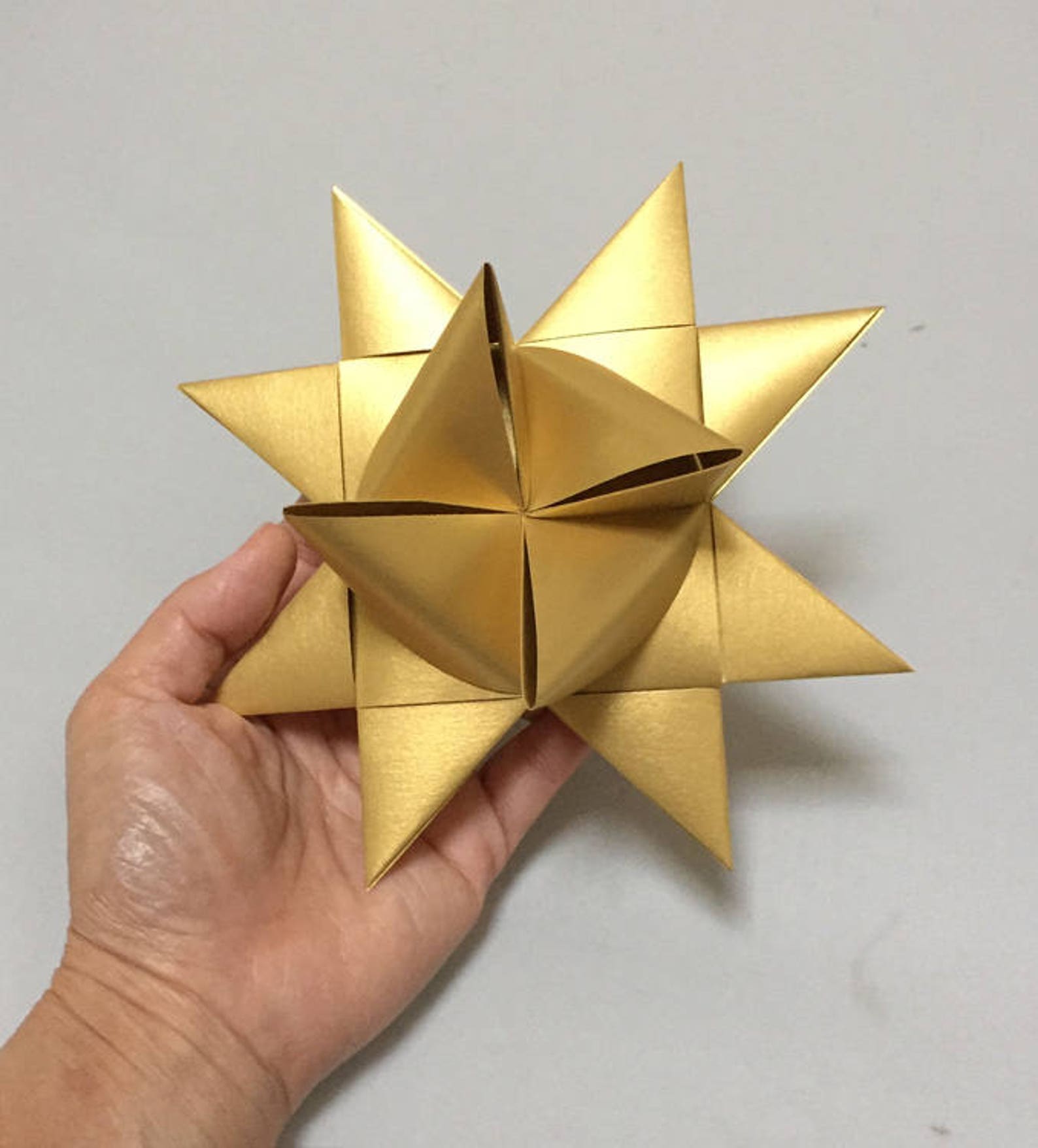 Large Moravian Stars: 5.5 to 6 inches in size, Metallic Gold in Color. Sold individually