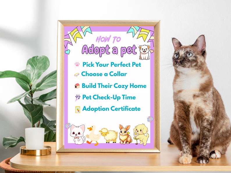 May include: A framed poster with the text "HOW TO Adopt a pet" and steps for pet adoption. The poster has a light purple background with cartoon animal illustrations. A tortoiseshell cat sits to the right of the poster.