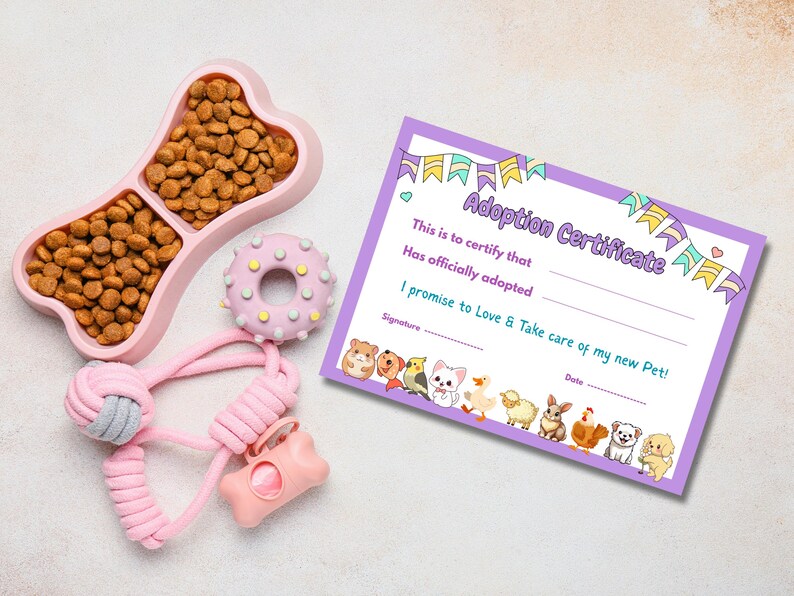 May include: A pink dog bone-shaped food bowl filled with brown kibble, a pink donut-shaped toy, a pink rope toy, and a pink bone-shaped bag dispenser. A purple adoption certificate with the text "Adoption Certificate" and cute animal illustrations.