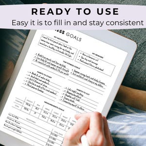 May include: A black and white fitness goals planner displayed on a tablet. The planner includes sections for motivation, rewards, fitness goals, and measurements. The text "READY TO USE" and "Easy it is to fill in and stay consistent" are visible at the top.