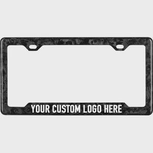 May include: Black and gray license plate frame with a carbon fiber pattern. The frame has a rectangular shape with rounded corners and features the text "YOUR CUSTOM LOGO HERE" in white letters at the bottom.