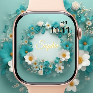 May include: A rose gold smartwatch with a floral design on the screen. The screen displays the name "Sophie" in cursive, surrounded by white and teal flowers. The time reads 11:11 on Friday.