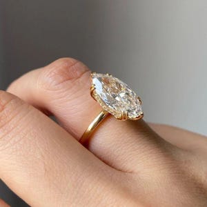 Marquise Cut Moissanite Engagement Ring: 14k Yellow Gold Hidden Halo