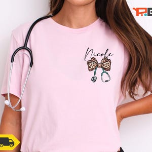 Custom Name Nurse Shirt, Leopard Coquette Bow Nurse Tee, Pocket Print Nurse Name Tee, Nurse Appreciation Gift, Personalized Doctor T Shirt