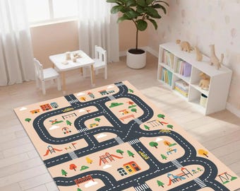 May include: A beige play mat featuring a road map design with winding roads, crosswalks, buildings, trees, and playground elements. The mat is designed for children's play and learning.