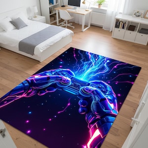 May include: A rectangular rug with a neon-style illustration of hands holding a video game controller. The rug has a dark blue background with bright blue and pink lightning effects and stars. The rug is placed in a bedroom.