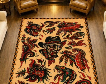 May include: Rectangular area rug with a tan background and a black, red, and green tattoo-style design. The rug features various illustrations, including a snake, a man in a hat, and other traditional tattoo motifs. The border is black and orange.
