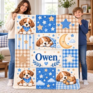 May include: A soft, rectangular fleece blanket featuring a patchwork design with blue and beige gingham patterns, stars, clouds, and a crescent moon. The blanket displays illustrations of beagle puppies and the name Owen in blue text.