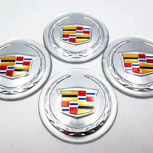 Juego de 4 pegatinas plateadas para el centro de la rueda de 65 mm para Cadillac: accesorios para coche, emblemas, insignias, pegatinas y logotipo de Cadillac.