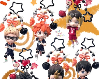May include: Collection of anime-style character keychains. Each keychain features a small figurine with detailed facial features and clothing, attached to a star-shaped charm with decorative beads and bows. The keychains are in various colors, with the Japanese text "ハイキュー!!!" at the top.