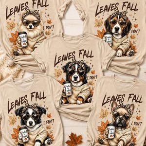 Könnte beinhalten: Fünf beige T-Shirts mit einer Grafik eines Hundes, der ein Leoparden-Stirnband und eine Sonnenbrille trägt und einen Kaffeebecher hält. Der Text lautet "LEAVES FALL I DON'T". Jedes Shirt zeigt eine andere Hunderasse inmitten von Herbstblättern.