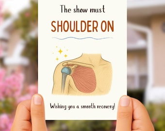 May include: A get-well card held by hands, with an illustration of a shoulder and the text "The show must SHOULDER ON" and "Wishing you a smooth recovery!" The card has a light beige background with a blue line and yellow star accents.