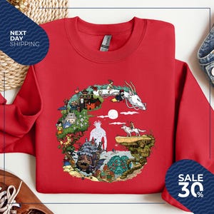 a red t-shirt with a colorful graphic design depicting various characters and scenes from the animated film "Spirited Away".