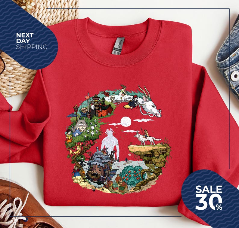 a red t-shirt with a colorful graphic design depicting various characters and scenes from the animated film "Spirited Away".