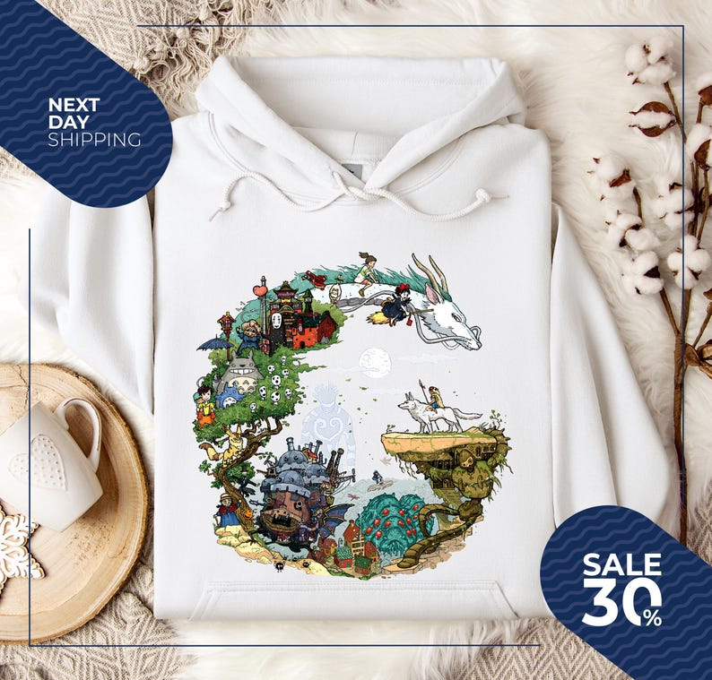 a white hoodie with a colorful illustration of a castle, dragon, and other fantastical elements, along with a sale sign indicating a 30% discount.